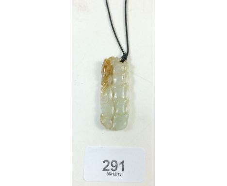 A Chinese jade pendant in bamboo form