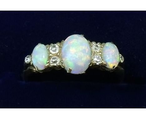 An Edwardian opal and diamond ring- 18ct gold but unmarked in original box, size P