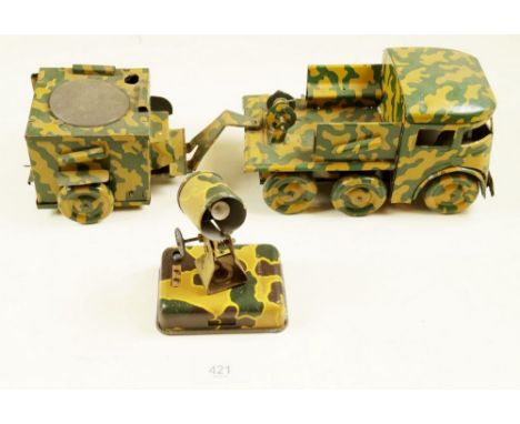 A French tinplate army truck and artillery trailer plus an English search light - all with camouflage print