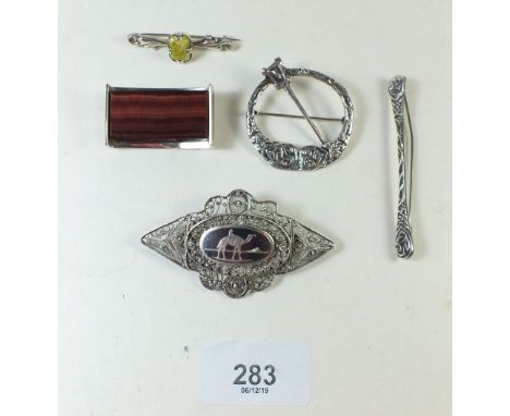 A group of silver and white metal jewellery including niello brooch and Celtic pin