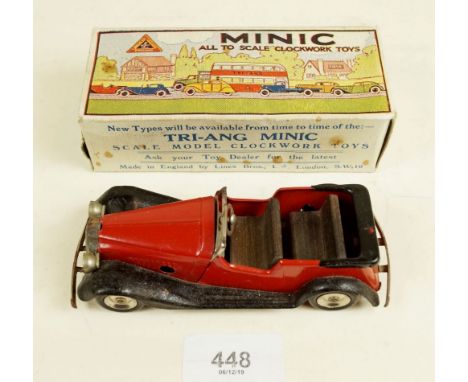 A Triang Minic tinplate clockwork Vauxhall Tourer in red and black (17M) boxed