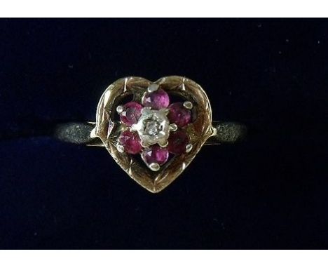 A 9 carat gold heart form ring with ruby and chip diamond cluster, size O