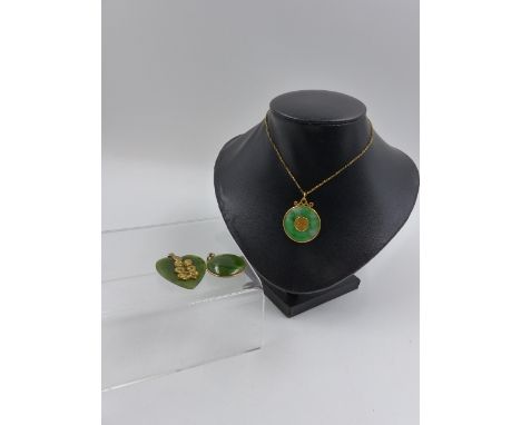 A PRECIOUS METAL MOUNTED JADE DISC PENDANT WITH AN ASIAN CHARACTER IN THE CENTRE AND ONE OTHER TOGETHER WITH A GREEN HEART SH