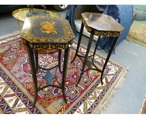 A PAIR OF REGENCY STYLE OCTAGONAL TOP LAMP TABLES DECORATED WITH CLASSICAL MOTIFS WITH SPLAYED LEGS JOINED BY SHAPED CROSS ST