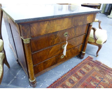 A FRENCH MAHOGANY ORMOLU MOUNTED MARBLE TOP EMPIRE STYLE COMMODE WITH FOUR LONG DRAWERS.   H.89cms   W.114cms.