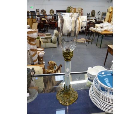 A VICTORIAN OPALESCENT GLASS BRASS MOUNTED LAMP WITH STORM SHADE.   OVERALL H.58cms.