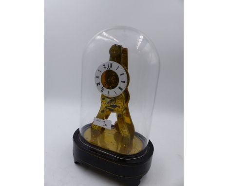 A SMALL 19th.C.SKELETON CLOCK WITH ENAMEL DIAL, THE BASE SIGNED M.HONORABLES. EXP. PARIS/LONDRES.