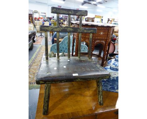 A RUSTIC STYLE VERNACULAR FORM LOW CHAIR WITH STICK BACK.