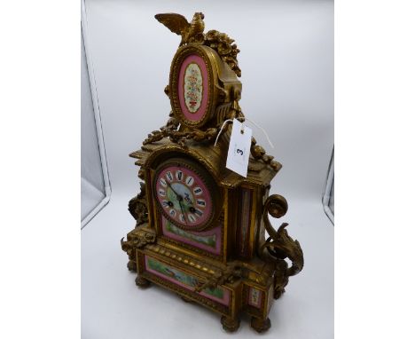 A VICTORIAN GILT METAL CASED MANTLE CLOCK WITH PORCELAIN HANDPAINTED INSET PANELS AND DIAL. 8-DAY BELL STRIKE MOVEMENT SIGNED