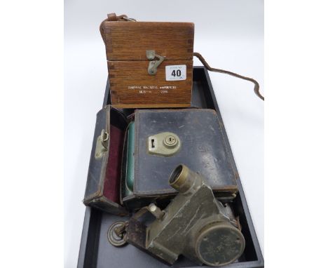 A VINTAGE COWLEY SURVEYING LEVEL, A GERMAN EMIL BUSCH PERISCOPIC SIGHT AND A BRITISH MILITARY COMPASS.  (3)