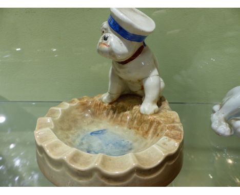 A ROYAL DOULTON MODEL OF A BULLDOG.   H.9cms. HN 1074 ANOTHER HN 1074 AND FIVE OTHER MODELS OF BULLDOGS.   (7)