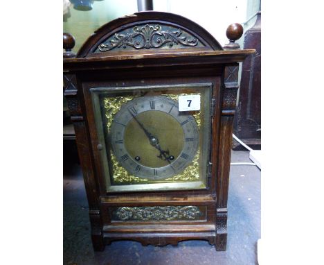 A LATE VICTORIAN OAK CASED MANTLE CLOCK WITH WINTERHALDER & HOFFMEIR MOVEMENT.   H.37cms.