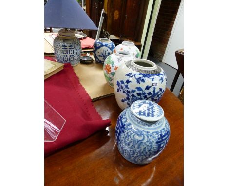 A GROUP OF SEVEN ANTIQUE AND LATER CHINESE AND ORIENTAL GINGER JARS, FIVE WITH BLUE AND WHITE DECORATION AND ONE MOUNTED AS A