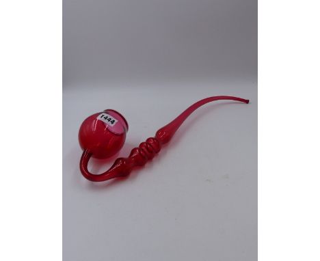 A CRANBERRY GLASS PIPE.   L.42cms.