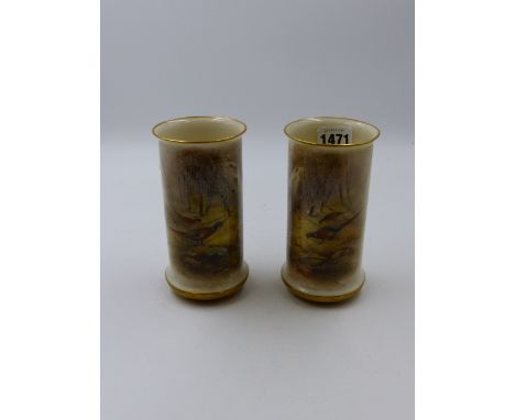 A PAIR OF ROYAL WORCESTER CYLINDRICAL VASES PAINTED WITH PHEASANTS AND WATERFALLS BY JAMES STINTON. H.14cms. CONDITION -VERY 
