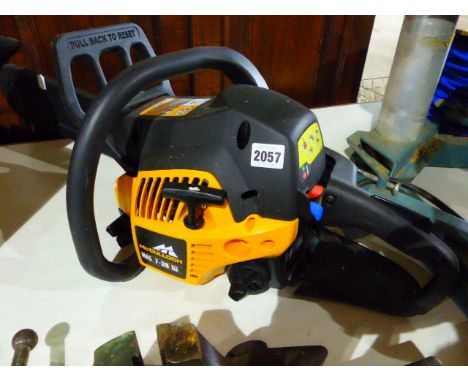 A McCULLOCH CHAINSAW IN APPARENT UNUSED CONDITION.