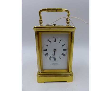 AN ANTIQUE BRASS CASED FIVE GLASS CARRIAGE CLOCK WITH WHITE ENAMEL DIAL SIGNED J W BENSON, 8-DAY STRIKING MOVEMENT WITH REPEA