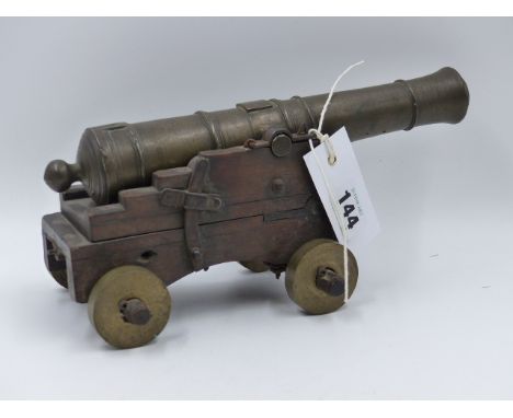 A 19th.C.BRONZE MODEL CANNON ON HAND MADE STEPPED CARRIAGE WITH ADJUSTABLE ELEVATION.