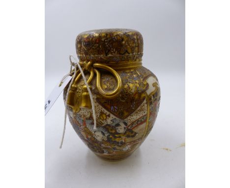 A JAPANESE SATSUMA TEA CADDY WITH DOME COVER AND INNER LID, RAISED GILT BROCADE DECORATION WITH FIGURAL PANELS.   H.14.5cms.