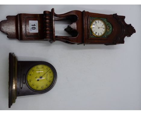 AN INTERESTING SMALL CARVED MAHOGANY CASED WALL CLOCK WITH SWISS MOVEMENT TOGETHER WITH AN ART DECO BAKELITE THERMOMETER.  (2