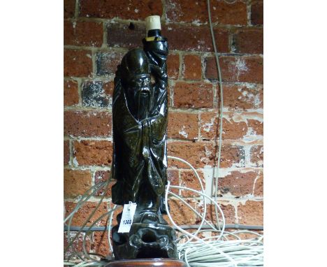 A CHINESE CARVED HARDWOOD FIGURE OF A SAGE NOW MOUNTED AS A LAMP WITH OVERALL WIRE INLAY.   H.62cms OVERALL.