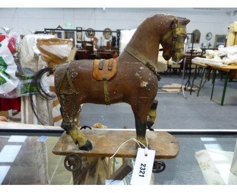 A 19th.C.FOLK ART HAND PAINTED MODEL HORSE ON WHEELED BASE AND ASSOCIATED PAINTED FLAT BED FARM CART.