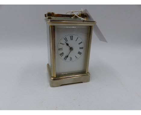 AN EARLY 20th.C.SILVERED BRASS CASED STRIKING CARRIAGE CLOCK WITH WHITE ENAMEL DIAL, THE MOVEMENT SIGNED R & Co, MADE IN PARI