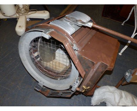 A LARGE STEEL CASED AND ALLOY THEATRE LAMP ON AN ASSOCIATED STAND.