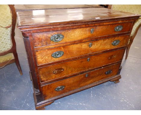 A GEORGIAN MAHOGANY BATCHELOR'S CHEST OF FOUR DRAWERS, THE UPPER DRAWER WITH VARIOUS COMPARTMENTS AND STANDING ON SHAPED OGEE