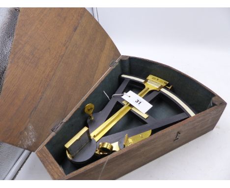 A 19th.C.EBONY AND BRASS OCTANT WITH  IVORY SCALE CONTAINED IN AN OAK SHAPED CASE.