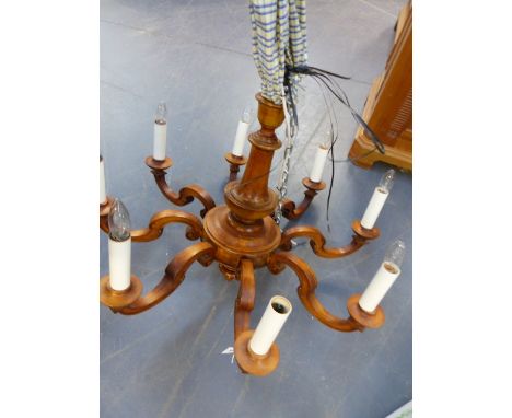 A CARVED FRENCH PROVINCIAL STYLE  EIGHT LIGHT CHANDELIER.   H.60 x Dia.85cms.