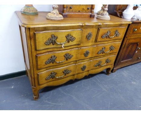 AN ANTIQUE STYLE FRENCH COMMODE CHEST OF TWO SHORT OVER TWO LONG DRAWERS WITH ELABORATE BRASS HANDLES.   W.128 x H.87cms.