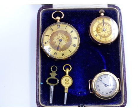 A LATE VICTORIAN LADIES 14K STAMPED MANUAL WOUND OPEN FACE FOB WATCH WITH A GILT DIAL AND ROMAN FIGURES, NUMBER 2 WINDING KEY