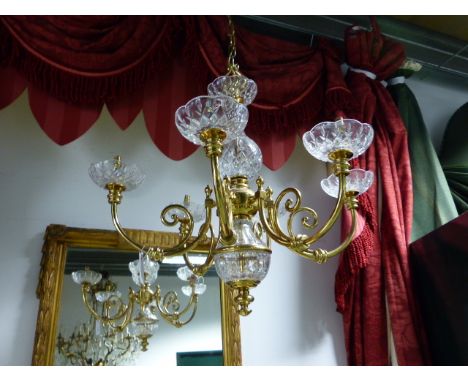 A GOOD QUALITY BRASS AND CRYSTAL SIX LIGHT CHANDELIER, SCROLL FORM ARMS.   H.70cms.  Dia. 74cms.