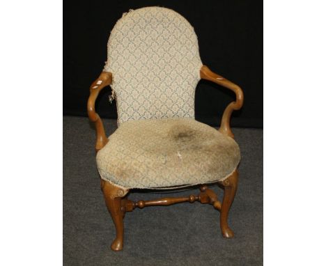 An early 20th century walnut framed Queen Anne style tapestry upholstered open armchair, on cabriole forelegs