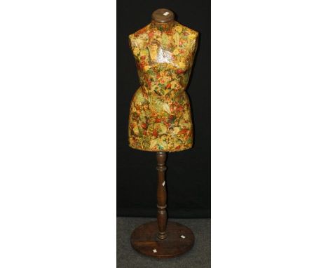 An Edwardian dress makers mannequin with decoupage decoration and turned wood stand