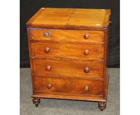 An early 19th century mahogany commode chest, the double hinged top over four false drawers with knop handles, on turned feet