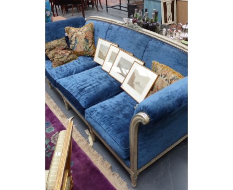 An antique French Louis XVI style painted show frame deep seated salon sofa