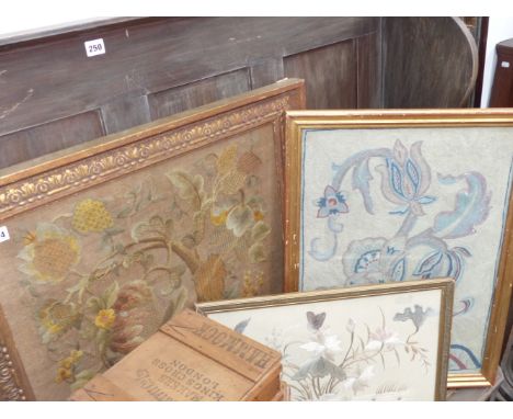 A gilt framed Arts and Crafts style needlework panel and two others