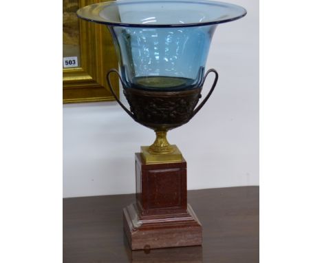A pair of bronze mounted marble based twin handle glass garniture urns