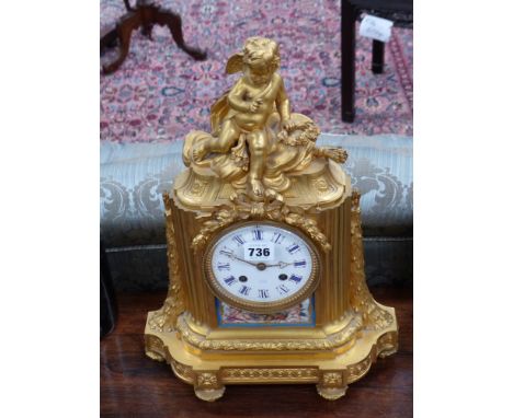 A Victorian gilt bronze mantle clock inset with painted porcelain panel, enamelled dial signed Patton,Paris