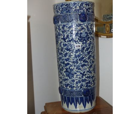 A Chinese blue and white umbrella/stick stand, flower heads and scrolling foliage