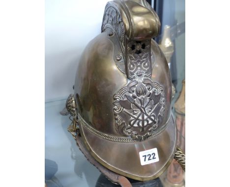 An Antique brass Merry Weather pattern fireman's helmet with STD issue badge and chain chin strap