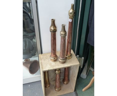 A good collection of bronze and copper fireman's hose, nozzles, couplings and stand pipes