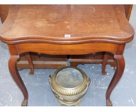 A 19th.c.colonial teak fold over card table on shaped and carved cabriole legs labelled Jhanda & Sons Sialkot Cantt?