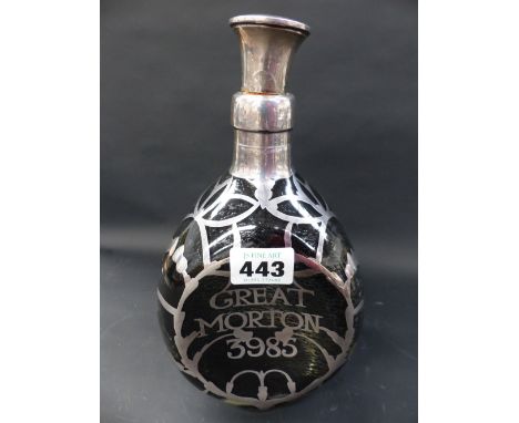 A silver overlaid Haig whiskey decanter of dimpled form. Inscribed Great Morton 3985. Hallmarked stopper