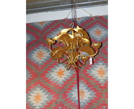A gilt metal five light chandelier formed as a cluster of leaves