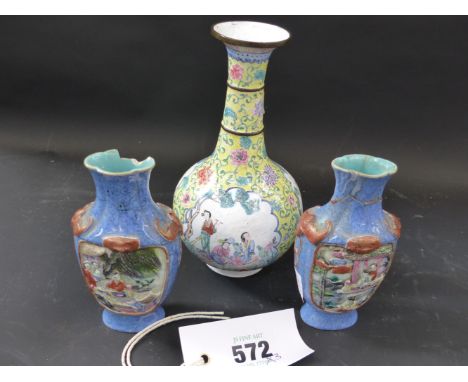 A Chinese enamel bottle vase decorated in the famille rose pallette with panels of figures. Seal mark to base and a small pai