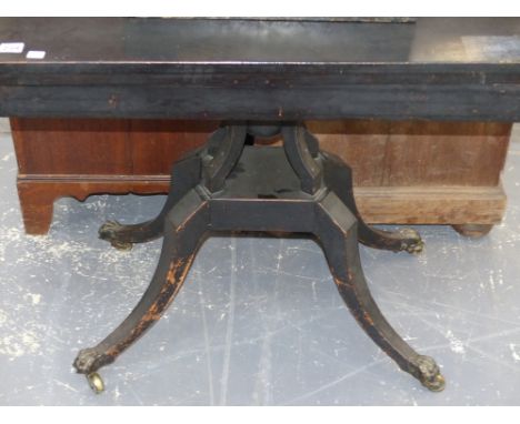 An unusual Regency ebonised fold over card table