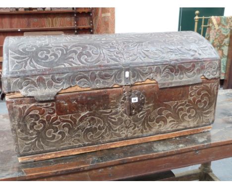 A 17th/18th.C. Leather bound carriage trunk with iron lockwork and handles